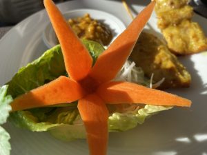 a beautiful Vegetable Sculpture of a flower made from a carrot