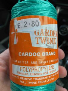 tomato twine, a rot proof idea that's a great two minute top gardening tip.
