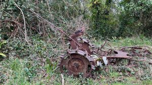 Rusty horticultural machinery on Weston Plats, East Devon, that replaced a donkey
